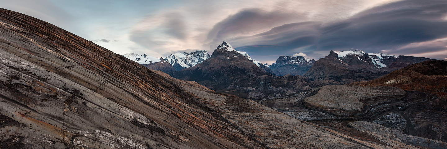 Panoramic shot of mountains and a huge lenticular cloud