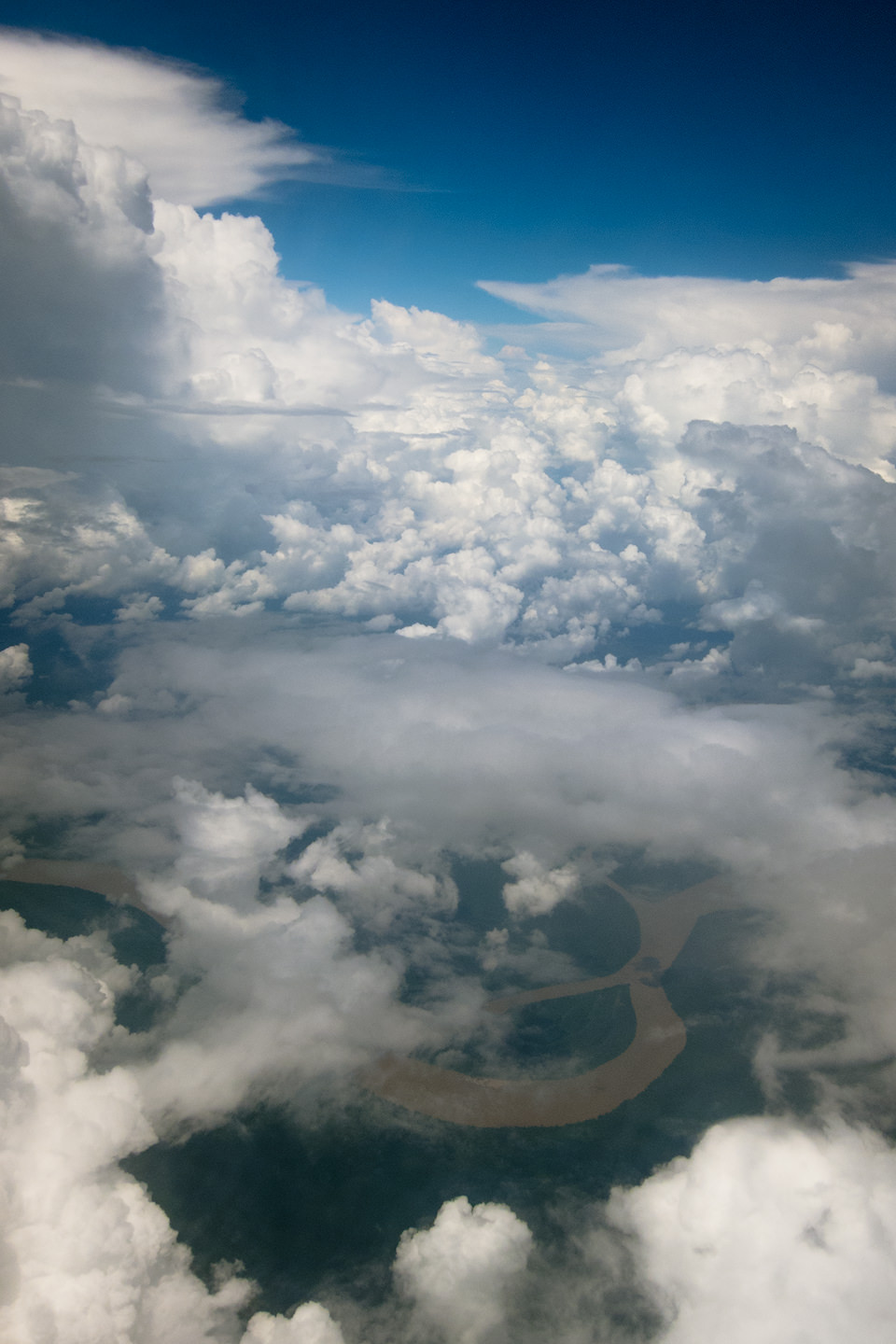Aerial view of the Amazon river and clouds.