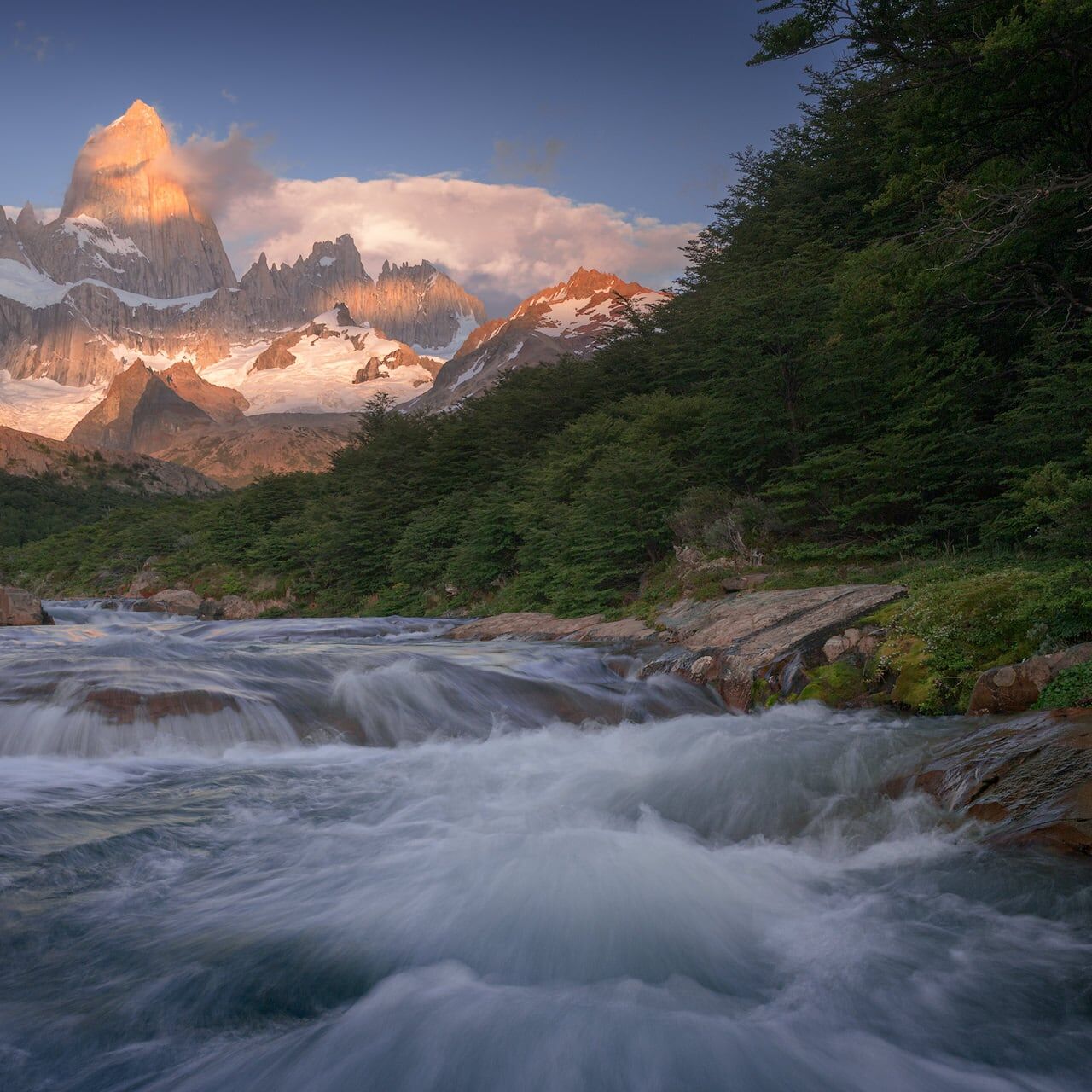 Fitz Roy at sunrise above the rapids of Arroyo del Salto Fitz Roy in morning light above the rapids of Arroyo del Salto at sunrise, El Chaltén, Patagonia