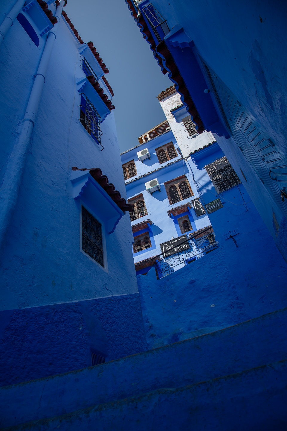 Blue houses looking up a street in Chefchaouen.