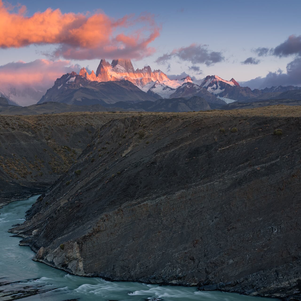 Cañadón del Río de las Vueltas — Fitz Roy Range at sunrise The full Fitz Roy Range above the Río de las Vueltas canyon at sunrise, El Chaltén, Patagonia