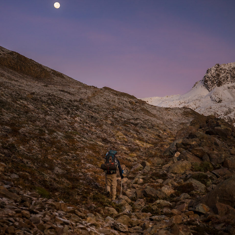 Guided by the Moon Hiker under a full moon above Paso del Viento