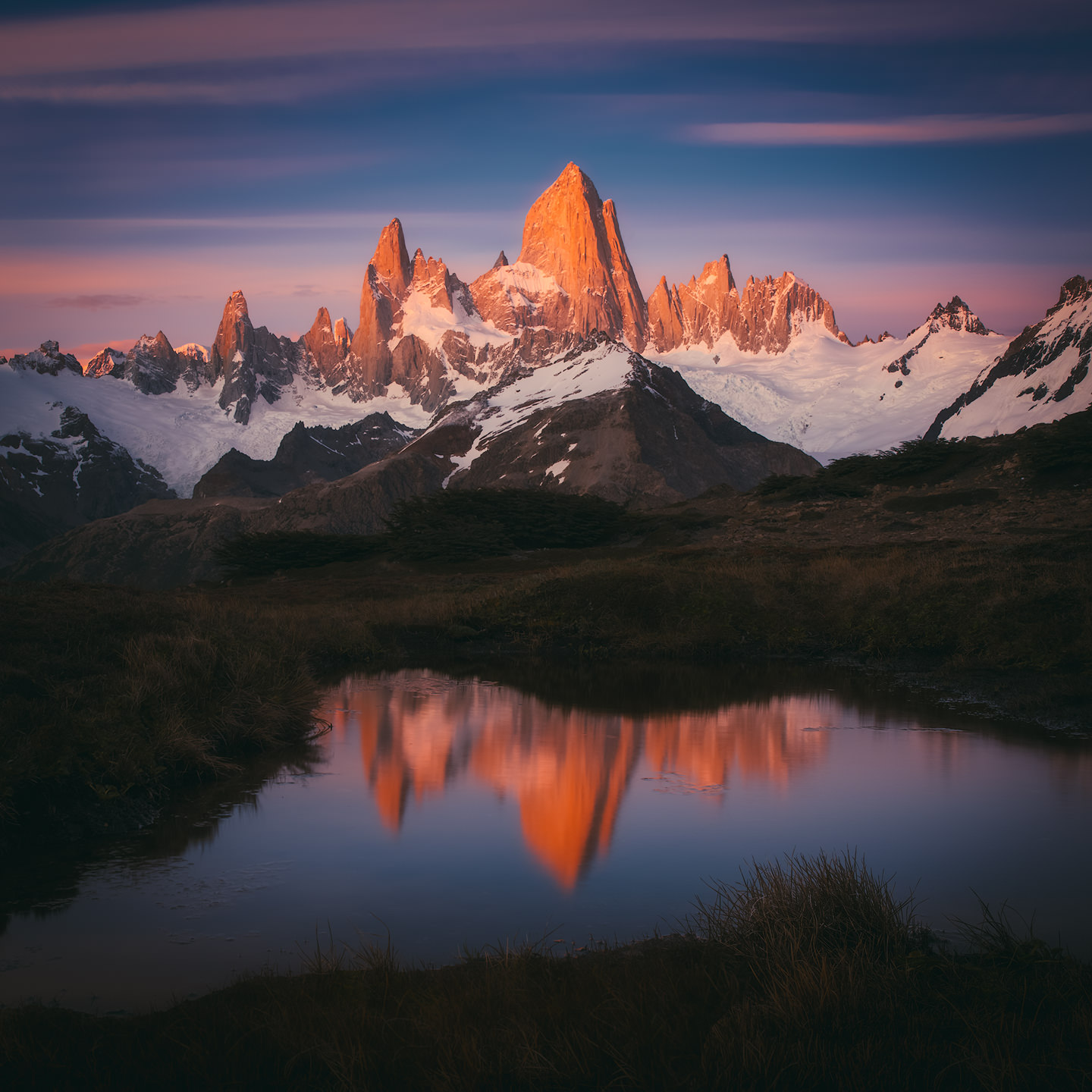 Fitz Roy reflected in a pond at sunrise.